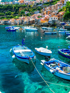 Boats lake with houses in the background